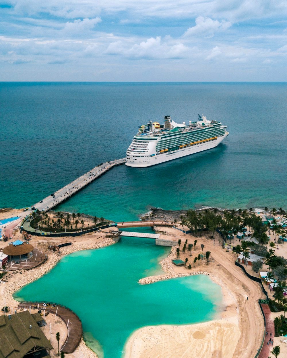 Cruise ship docked at a tropical port