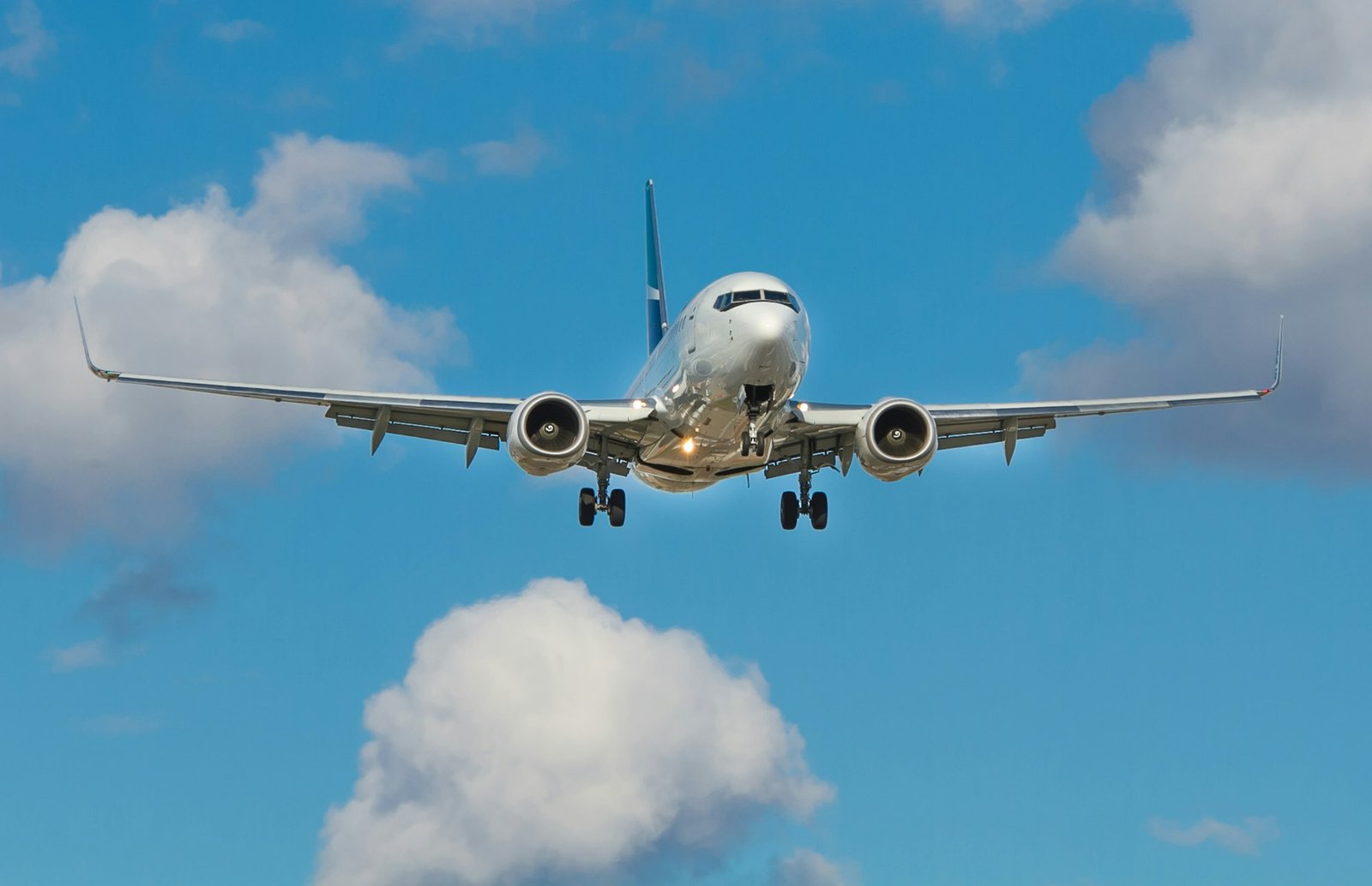 Aircraft approaching through a clear blue sky