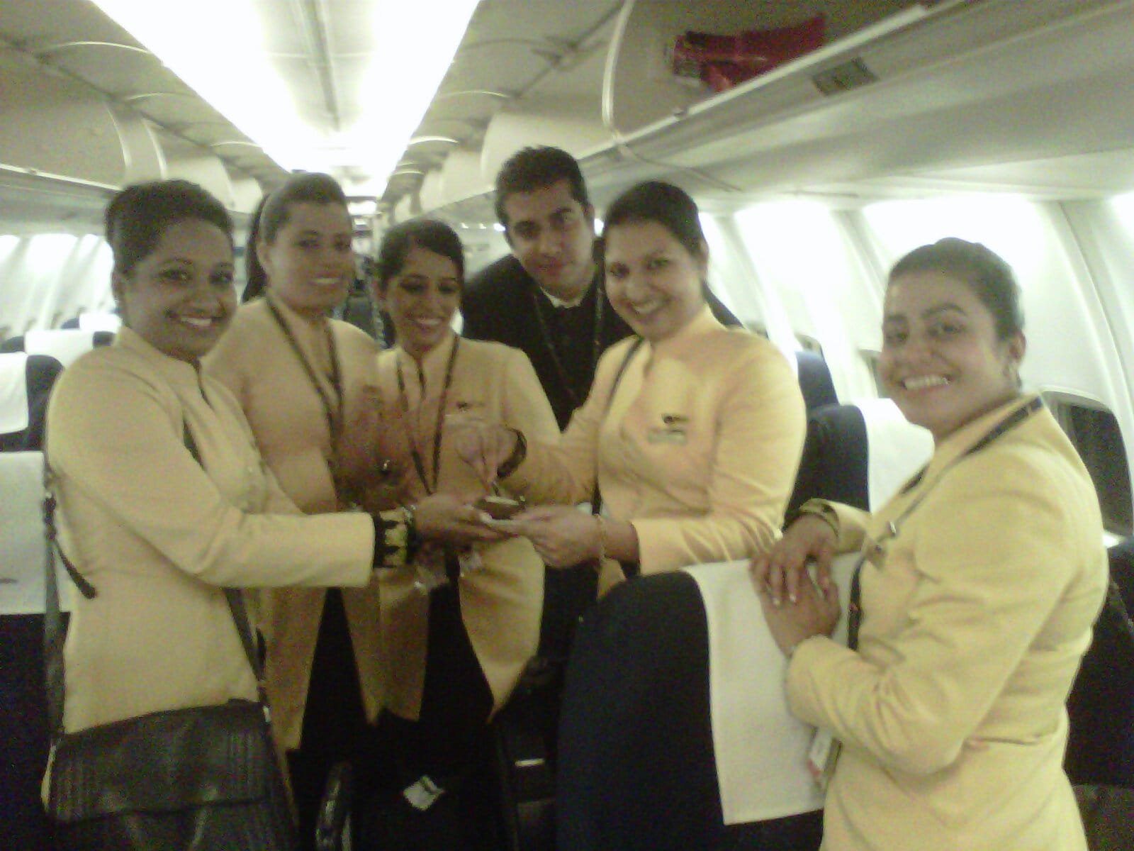 Cabin crew team celebrating onboard